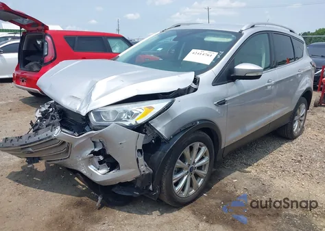 2017 Ford Escape Titanium z USA, uszkodzony, nr VIN 1FMCU0JD8HUE87385